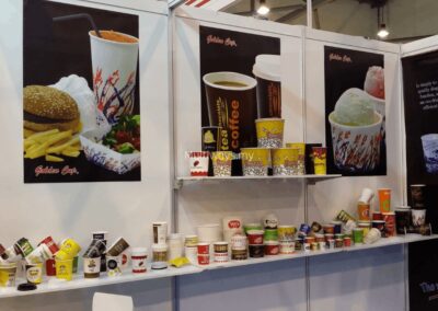 A curated wall display featuring our premium selection of paper cups, popcorn tubs, and versatile food bowls